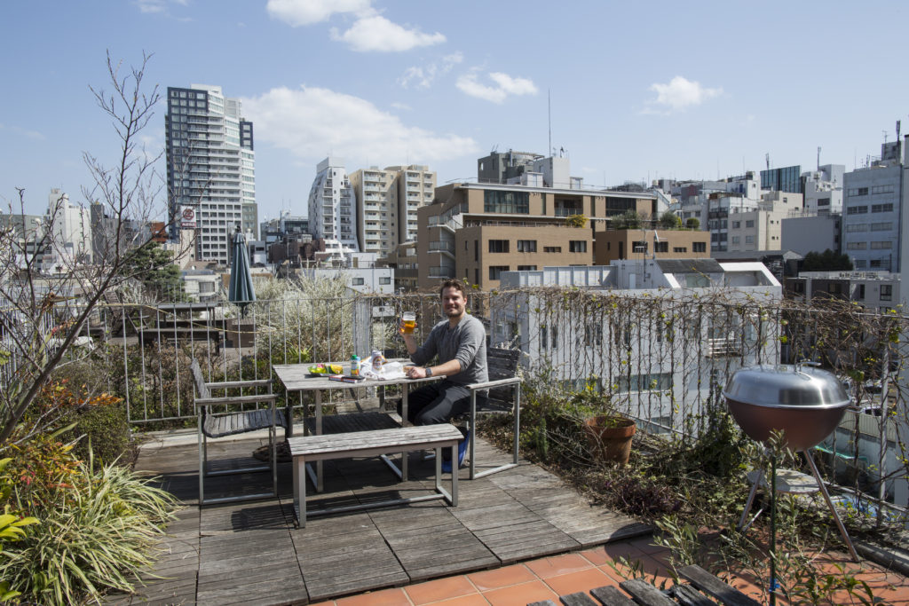 Enjoying a picnic on the private rooftop of our Airbnb near Shinjuku